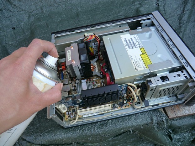 Image: Cleaning inside a computer with compressed air.