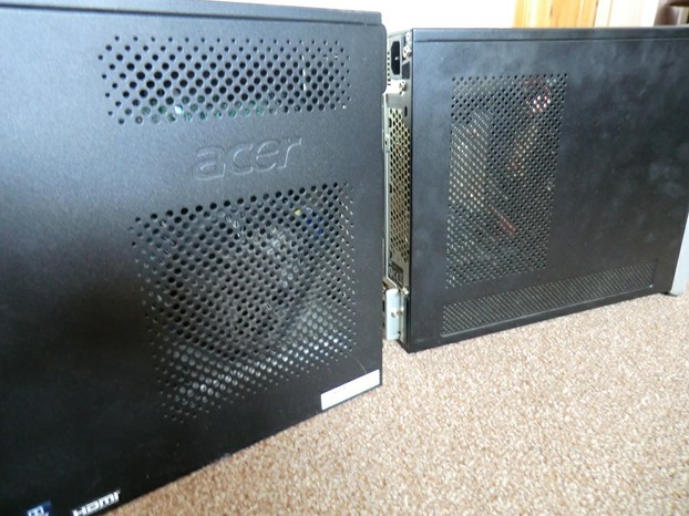 Image:  Two dusty computers waiting to be cleaned.