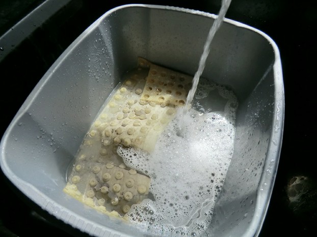 Image:  Keyboard's rubber membrane in the washing up bowl.
