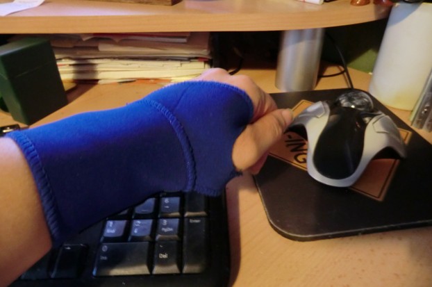 Image: Left hand supported against carpal tunnel syndrome.