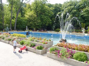A kid Staring in Wonder at a Fountain