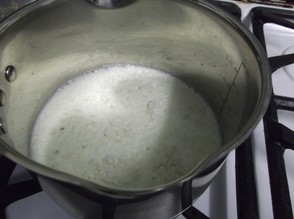 Add the milk, garlic and rice to a a pan, bring to the boil and then simmer gently for 12-13 minutes.