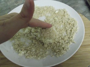 Take some of the cheese mixture and roll between the palms of your hands to form a ball. Then, roll in the breadcrumbs