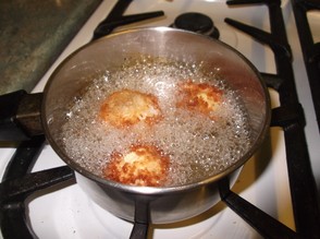 In batches, deep fry the balls in hot oil until they are golden brown.
