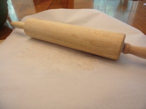 Place a place of greased parchment paper and roll out dough very thin