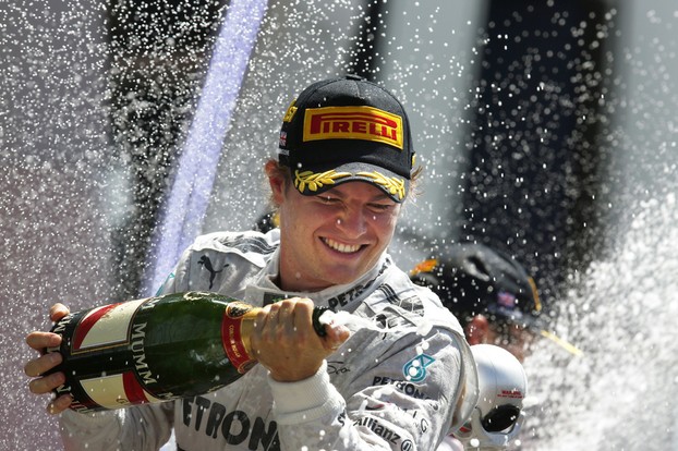 Nico Rosberg celebrates at Silverstone but the talk was about the company on his hat