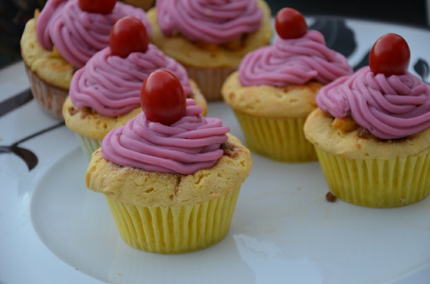 mac 'n' cheese cupcakes with mashed potato frosting topped with cherry tomatoes