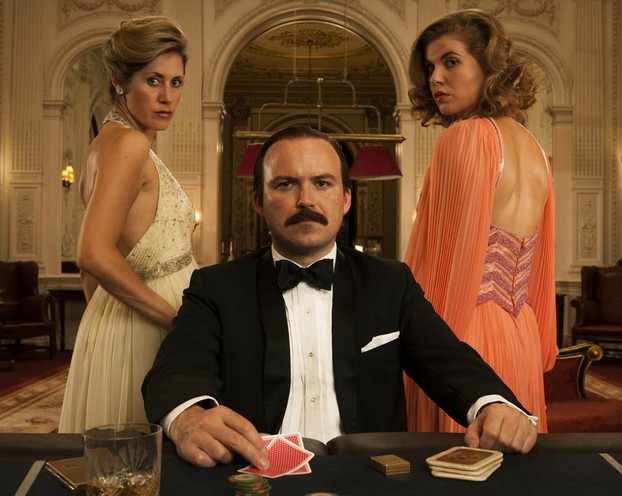 Rory Kinnear as Lord Lucan, flanked by actresses Mytle Vraets and Kya Garwood
