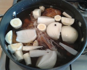 The Vegetables and Carcass in the Saucepan