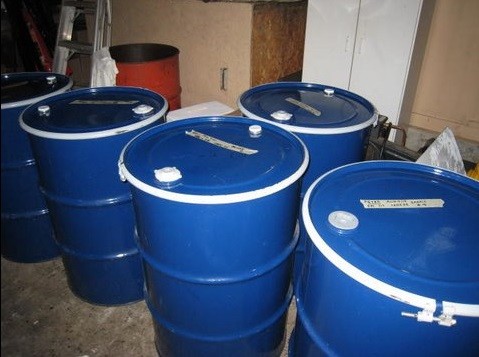 Honey barrels full of clover honey for sale to honey packers