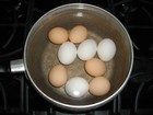 Boil eggs in a sauce pan