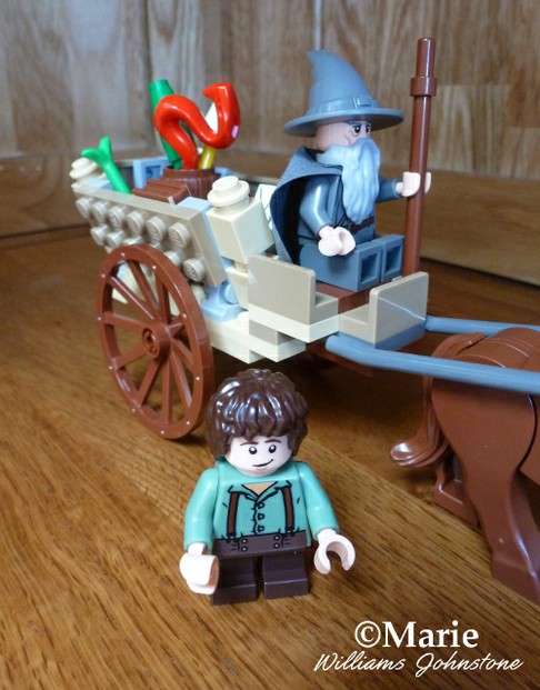 Gandalf Arrives Lego - see the red dragon firework in the back of the cart, ready to set off at Bilbo's 111st birthday