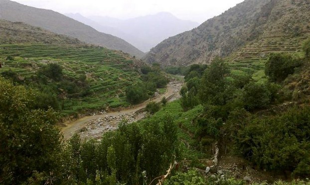 small terraced fields of Nuristan's remote villages along waterways winding through steep slopes of Hindu Kush
