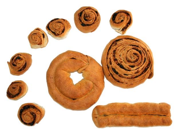 Pitta 'mpigliata's various shapes include collura ("donut"), rosellina ("rosette") and elongated nougat (lower right).