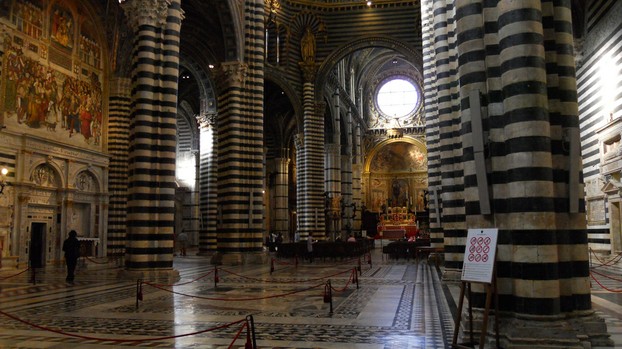 Notice the sign to the right indicating rules for conduct in this church in Siena.