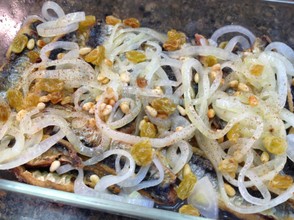 "Sarde en saor" is a traditional Venetian dish, where fried small fish are marinated with onions and vinegar.