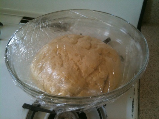 The pizza dough after having time to rise in a warm place.