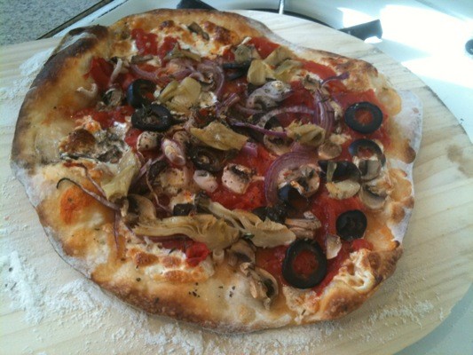 After 12-15 minutes of baking, my pizza is ready to be enjoyed.