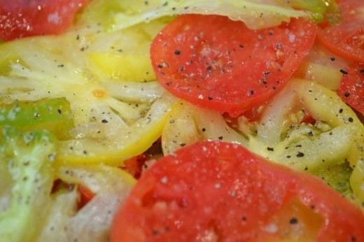Sliced heirloom tomatoes with salt and pepper
