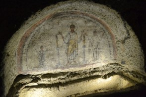 Paleo-Christian frescoes above a tomb in the Catacombs of San Gennaro.