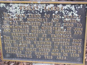 The aged marker at  the entrance to the walk.