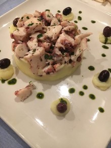 Octopus salad over potatoes