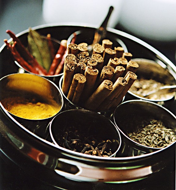 masala chai's spices, organized in a masala dabba (spice box)