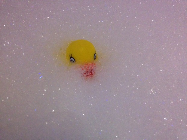 yellow rubber ducky in bubble bath