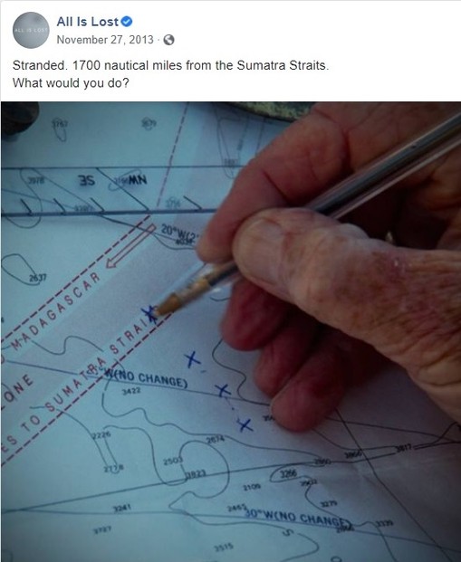 Our Man (Robert Redford) marks his boat's progress on a navigational map.