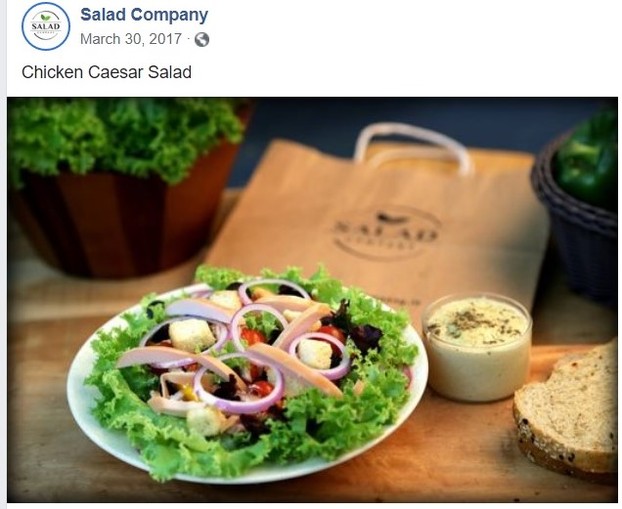Salad Company's Chicken Caesar Salad with homemade dressing and multigrain bread