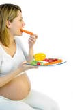 pregnant woman eating vegetables