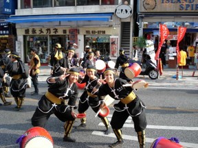 Some participants in the Naha Festival pose for a photograph.  The Finger Sign wishes one 'Good Luck'