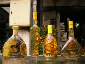 See The Snakes In Those Alcohol Bottles?