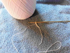 Thread the beads on without removing the yarn from the skein.