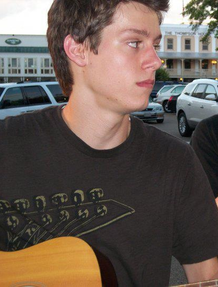 Josh Pillault with guitar.