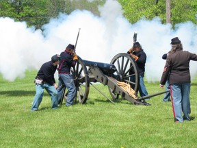 Civil War Re-enactors Firing a Canon