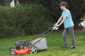 Teen mowing lawn 