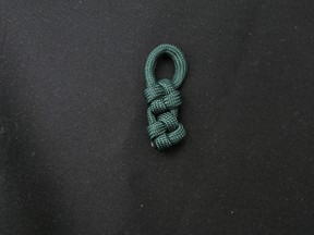 Cross knot zipper pull